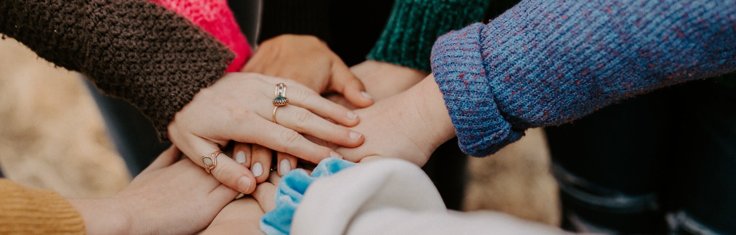 hands in symbolizing teamwork