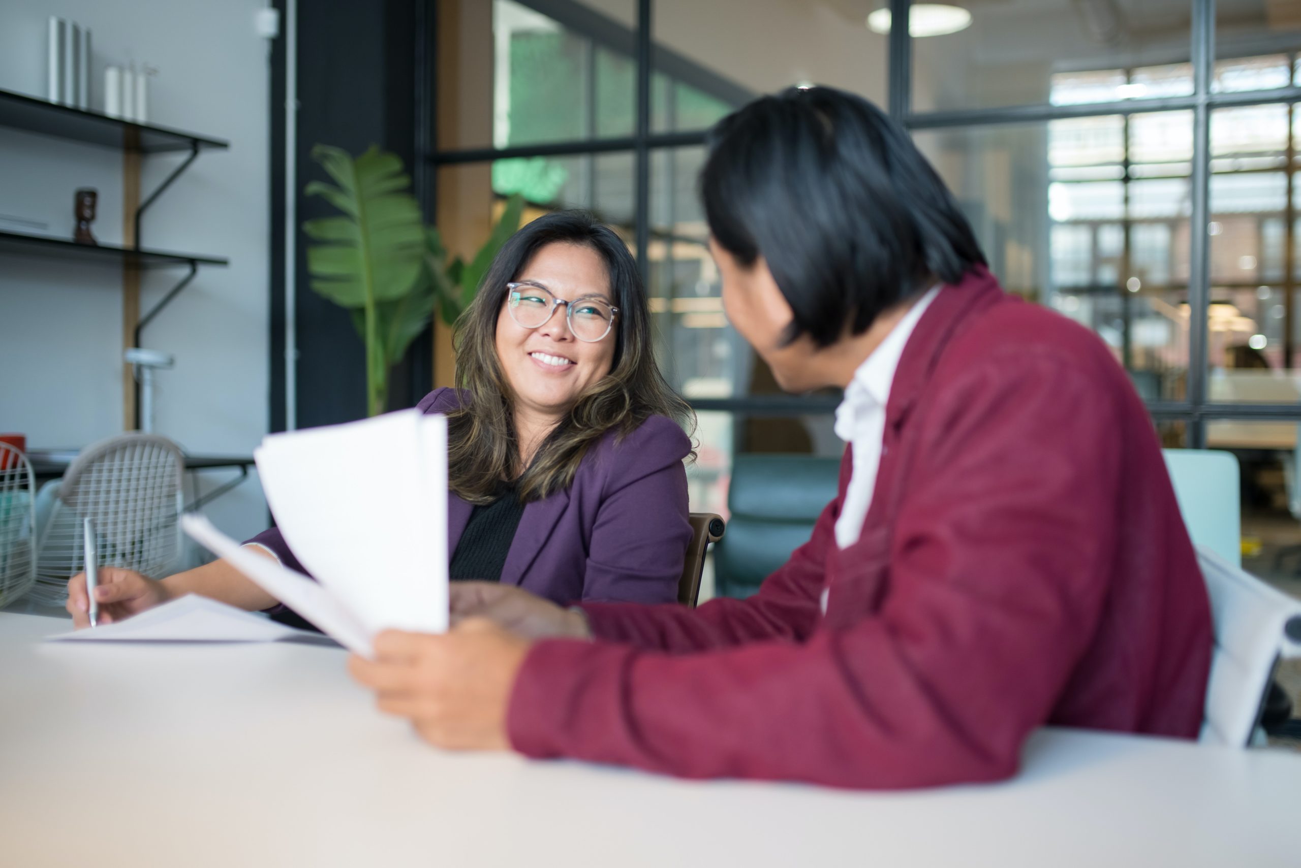 colleagues smiling in a meeting