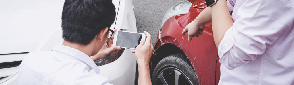 Two drivers man arguing after a car traffic accident collision a