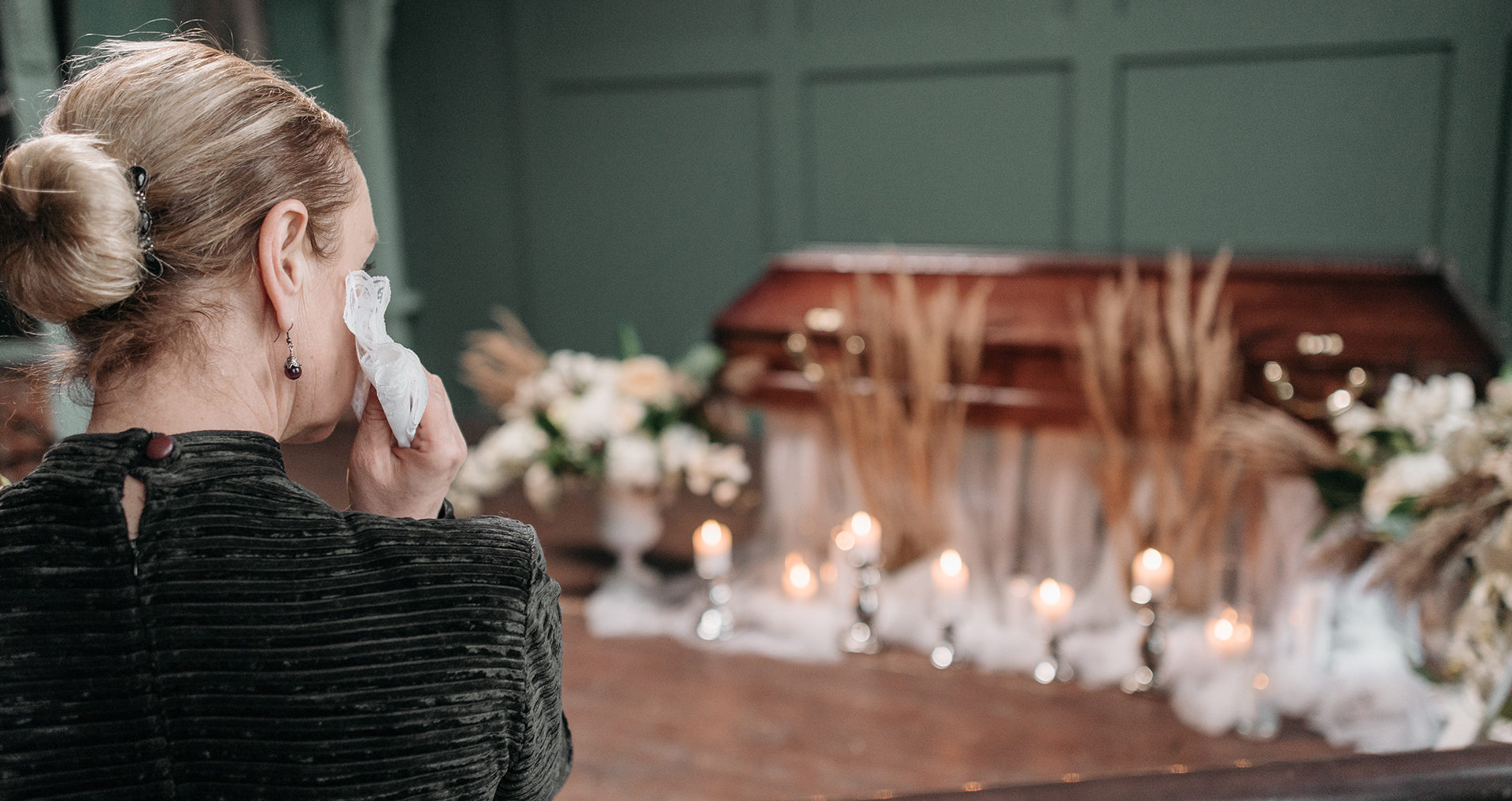 woman mourning at funeral